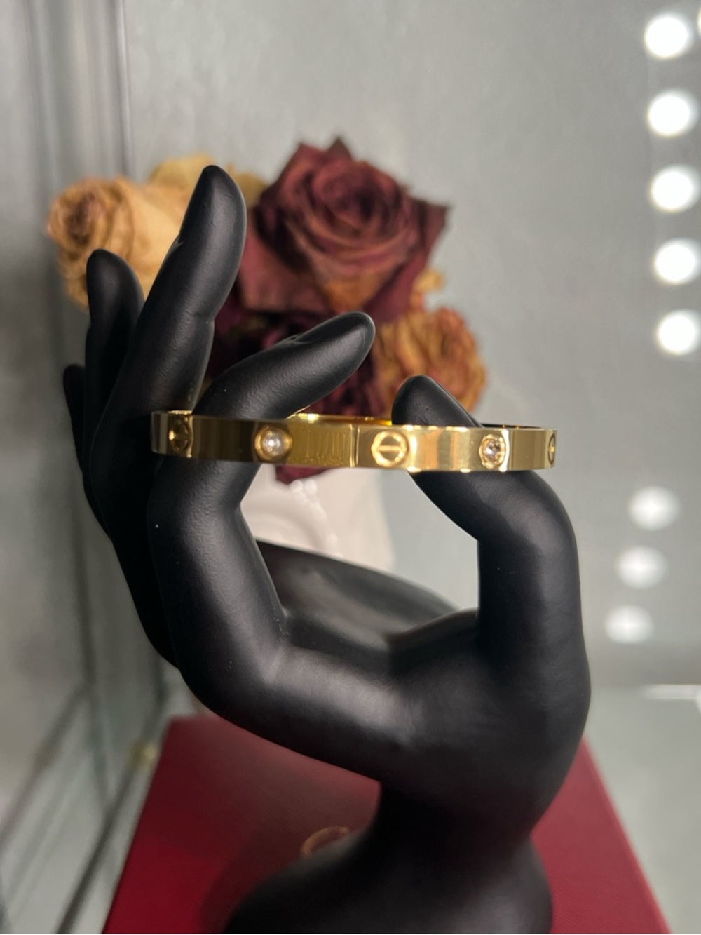 Gold tone bangle with stones
